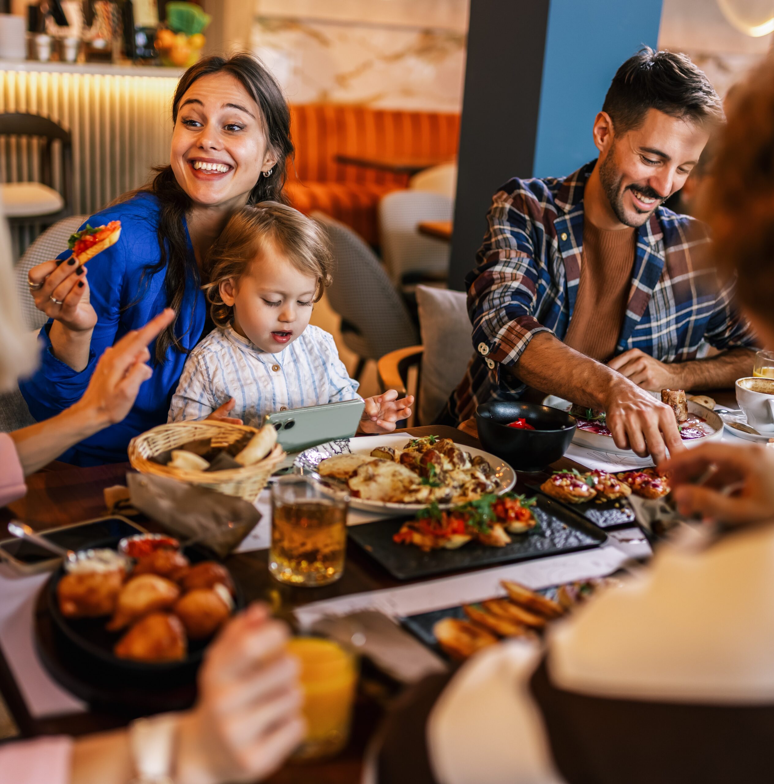 Family enjoying a meal at a restaurant
